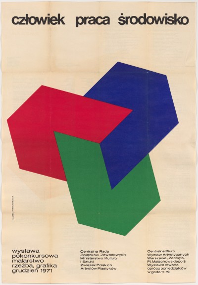 Na białym tle bardzo duży abstrakcyjny kształt składający się z trzech nieokreślonych figur geometrycznych: niebieskiej, zielonej i czerwonej.